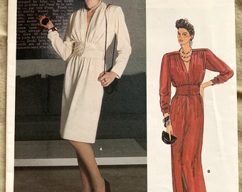 May include: A vintage sewing pattern for a dress with two different styles. The pattern is for a long, red dress with a slit up the front and a shorter, white dress with a fitted bodice. The pattern is from Vogue Patterns and is designed by Yves Saint Laurent. The pattern number is 1490.