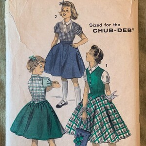 May include: Vintage sewing pattern for a girl's dress, size 10 1/2, with a green and white plaid skirt and a green vest. The pattern is from Advance, the easy printed pattern, and is sized for the Chub-Deb. The pattern number is 7742.