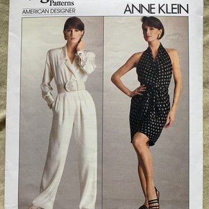 May include: Vogue Patterns sewing pattern for a white jumpsuit and a black and white patterned halter dress by American designer Anne Klein. The pattern number is 2052. The sewing rating is easy/facile.
