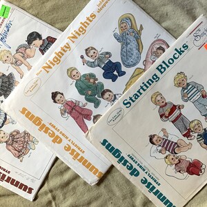 May include: Three vintage sewing patterns for baby clothes. The patterns are titled "Little Princess", "Nighty Nights", and "Starting Blocks". Each pattern features illustrations of babies wearing different outfits.