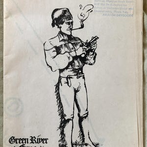 May include: A vintage pattern illustration for an 18th-19th century dropped sleeve shirt. The image shows a man smoking a pipe and holding a rifle. The text includes "Green River Forge" and copyright details.
