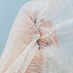 LL-1320 sparkling glitter tulle fabric in white color for lovely bridal and wedding dresses or also veils