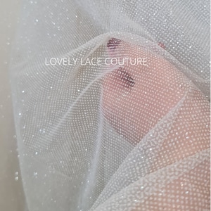beautiful sparkling glitter tulle fabric in off-white LL-1499 or ivory color LL-1500 for marvelous bridal and wedding dresses or also veils