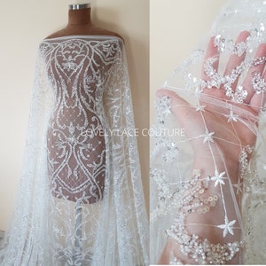 Glorious ornamental bridal lace fabric per metre in white color, wedding dress lace in high quality for stunning couture dresses, LL-1477