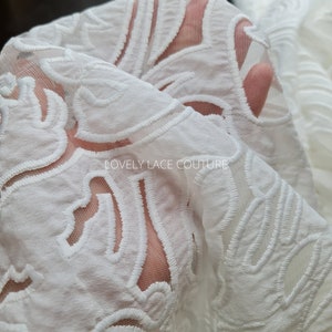 LL-1538, Stunning ornamental lace tulle fabric with cut outs in off-white color