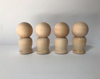 unfinished kokeshi dolls