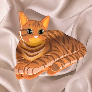 Spinka do włosów kota w kolorze imbirowo-pomarańczowym, wysokiej jakości