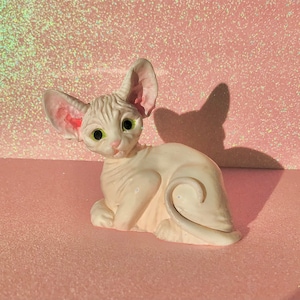 Painted sphynx figurine