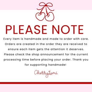 May include: A white rectangular sign with a red border and a red cherry illustration at the top. The text reads: PLEASE NOTE. Every item is handmade and made to order with care. Orders are created in the order they are received. CherryLumi.