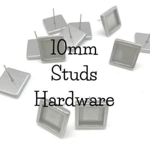 May include: Silver-toned 10mm square earring studs with a clear glass insert. The studs are for jewelry making and crafting.