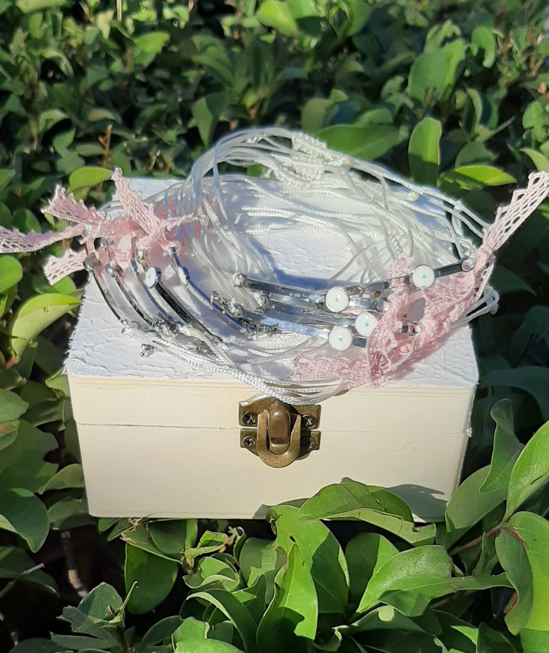 Witness bracelets for baptism with costume box.Girl and boy martyrika bracelets.Hand made with macrame. Silver and white evil eye and cross.