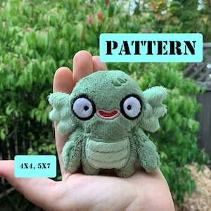 May include: Green plush toy with a toothy grin and large eyes. The toy is 4 inches by 4 inches and 5 inches by 7 inches. The text "PATTERN" is in a blue box above the toy and the text "4X4, 5X7" is in a blue box below the toy.