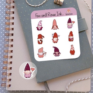 May include: A sheet of Valentine's Day themed stickers featuring gnomes with hearts and flowers. The stickers are from Fox and Rose Ink.