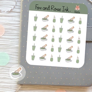 May include: A sheet of stickers featuring a variety of green matcha tea-themed illustrations. The stickers include cups of matcha, matcha whisks, and bottles of matcha. The sheet is labeled "Fox and Rooe Ink. Matcha."