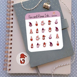 May include: A sheet of stickers featuring 20 different gnomes in various poses. The gnomes are wearing red and pink hats and have white beards. The stickers are arranged in a grid pattern on a white background. The sheet is labeled "Fox and Roe Ink."