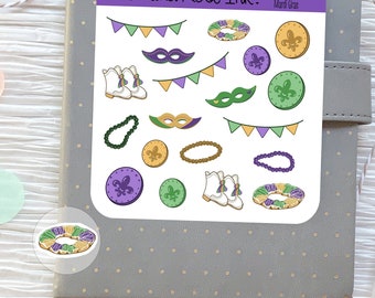 May include: A sheet of stickers featuring Mardi Gras themed designs. The stickers include a variety of colors, including purple, green, gold, and white. The stickers feature images of masks, beads, king cakes, and other Mardi Gras symbols. The sheet is labeled "Fox and Roe Ink." and "Mardi Gras."