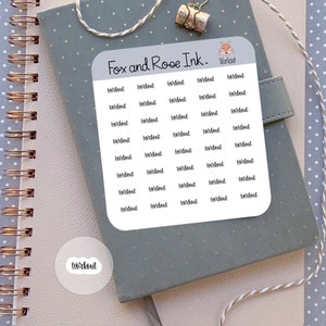 May include: A sheet of stickers with the text "Workout" repeated multiple times. The stickers are white with black text and are arranged in a grid pattern. The sheet is labeled "Fox and Rose Ink."