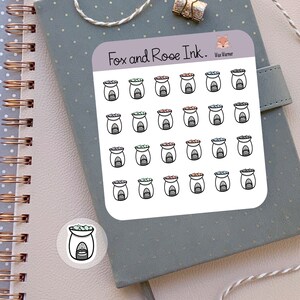 May include: A sheet of stickers featuring illustrations of wax warmers. The stickers are white with black outlines and feature different colored wax melts. The text "Fox and Roe Ink." and "Wax Warmer" are printed on the sheet.