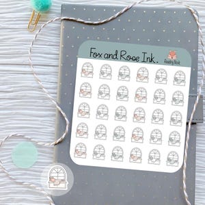 May include: A sheet of stickers with a reading nook theme, featuring a window with a blanket and pillow. The stickers are on a gray notebook with a dotted pattern. The text "Fox and Rose Ink" is at the top.