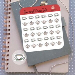 May include: A sheet of stickers featuring a repeated pattern of teapots and teacups with holly sprigs. The text "Fox and Rose Ink. Christmas Tea" is at the top of the sheet.