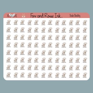 May include: A sheet of 100 stickers featuring a cartoon snake in various stages of shedding its skin. The stickers are white with brown outlines and feature the text "Starting to Shed" and "Shed Complete".
