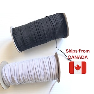 May include: Two spools of elastic cord, one black and one white, are shown against a white background. The elastic is tightly wound on cardboard spools. The image includes the text "Ships from CANADA" and a Canadian flag.