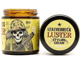 May include: A 4 oz jar of Leatherneck Luster Styling Cream. The jar has a yellow label with a cartoon illustration of a soldier holding a weapon. The label also includes the text "Leatherneck Luster Styling Cream" and "Lox and Company, LTD. Honesdale, PA."