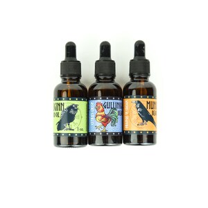 May include: Three 1-ounce amber glass bottles with dropper tops. Each bottle has a different label with a colorful illustration and text. The labels read "Munkinn Beard Oil Citrus Crisp", "Gullink Beard Orange & Cream", and "Munkinn Beard Oil".