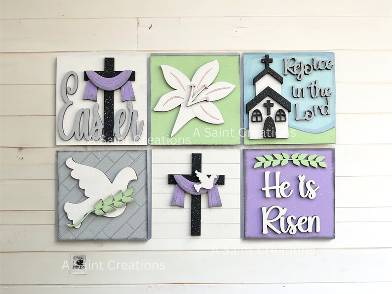 May include: Six wooden signs with Easter themes. The signs feature a cross with a purple scarf, a white lily, a church, a dove with an olive branch, a cross with a dove and a purple scarf, and a purple sign with the text "He is Risen".