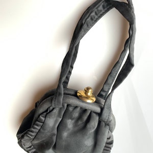 Black silk vintage purse with gold tone clasp