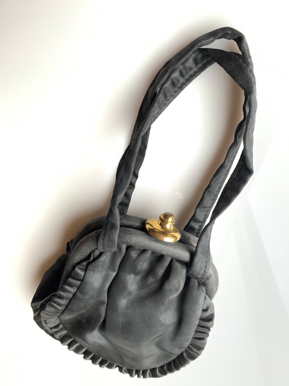 Black silk vintage purse with gold tone clasp