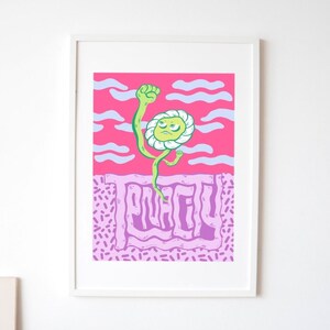 May include: A framed print featuring a pink background and a green cartoon flower with a raised fist. The flower is labelled "PLACID" in purple lettering.