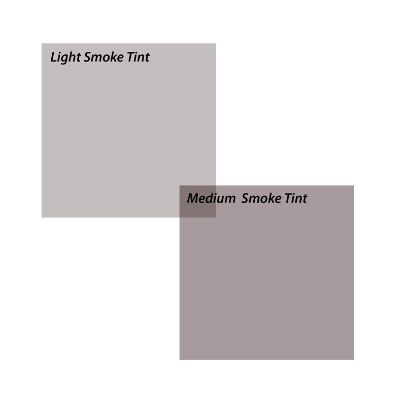 May include: Two samples of window tint, one labeled "Light Smoke Tint" and the other labeled "Medium Smoke Tint". The tint samples are gray.