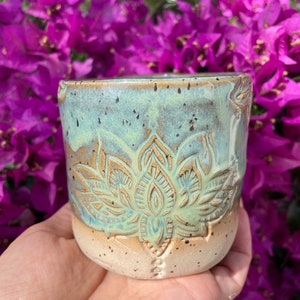 Cup made of pottery green ceramic handmade