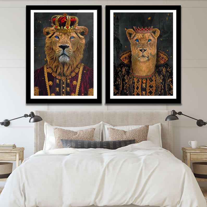 May include: Two framed prints of lions wearing crowns and royal robes. The lion on the left is wearing a gold crown and a red and gold robe. The lion on the right is wearing a gold crown and a black and gold robe.