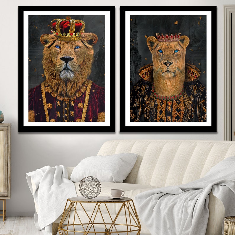 May include: Two framed prints of a lion and lioness wearing royal robes and crowns. The lion is wearing a red robe with gold trim and a gold crown with red jewels. The lioness is wearing a black robe with gold trim and a gold crown with red jewels. The background is a dark, textured pattern.