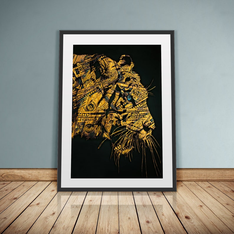 May include: An abstract art print of a tiger's face, in black and gold, with a blue eye, made from dollar bills.