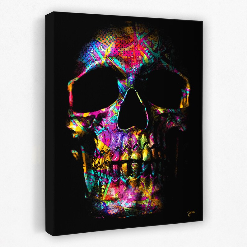 May include: A colorful skull with a black background. The skull is made up of a variety of bright colors, including pink, yellow, green, and blue. The skull is a close-up and fills the entire image.