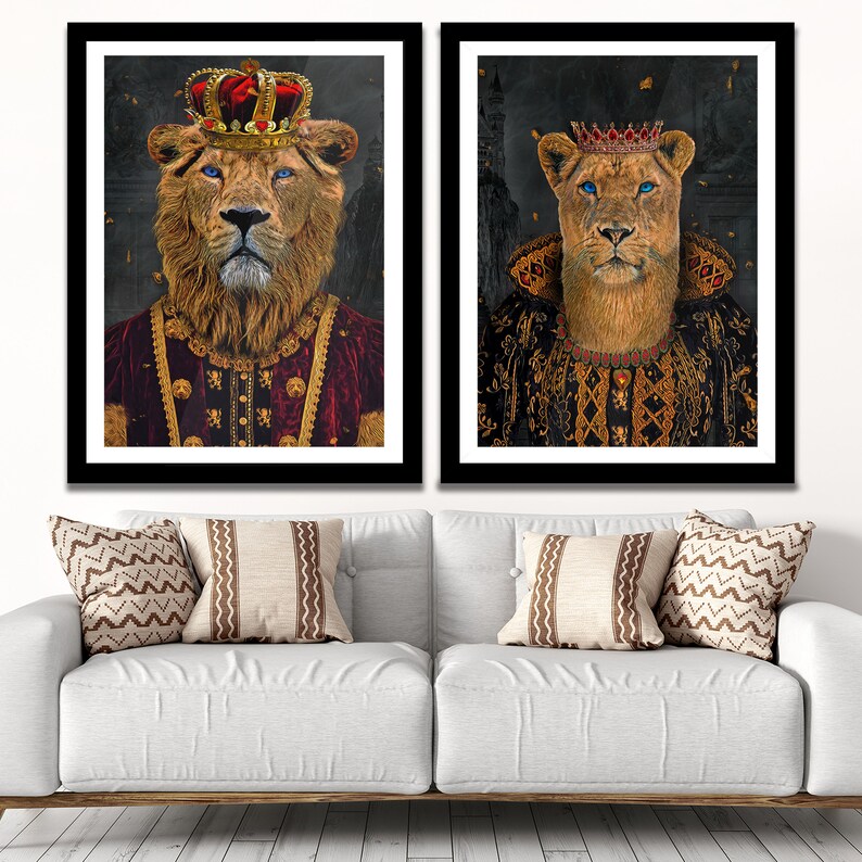 May include: Two framed prints of a lion and lioness wearing crowns and royal robes. The lion is wearing a red robe with gold accents and the lioness is wearing a black robe with gold accents.
