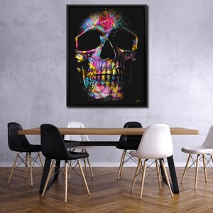 May include: A colorful abstract skull with a black background. The skull is made up of various shades of pink, blue, green, yellow, and orange. The skull is a graphic design element.
