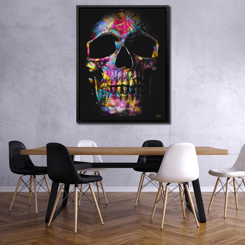 May include: A colorful abstract skull with a black background. The skull is made up of various shades of pink, blue, green, yellow, and orange. The skull is a graphic design element.