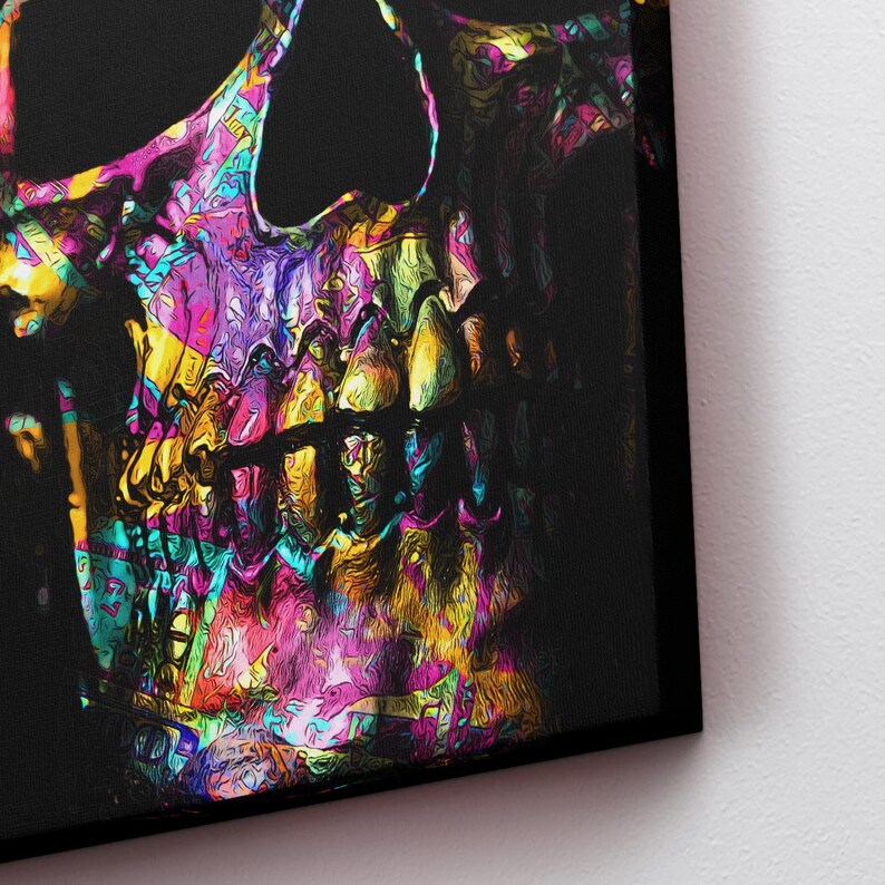 May include: A colorful, abstract skull with a black background. The skull is painted in a variety of bright colors, including pink, purple, yellow, and blue. The skull's teeth are visible and are painted in a bright yellow color.