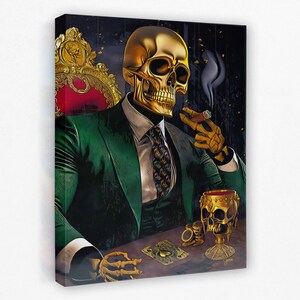 May include: A gold skull wearing a green suit and a tie sits in a chair with a cigar in its hand. The skull is holding a glass of red liquid and there are playing cards on the table in front of it.