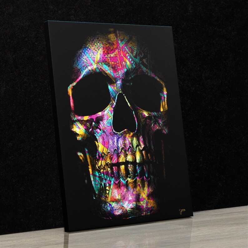 May include: A colorful skull with a black background. The skull is made up of a variety of colors, including pink, blue, green, yellow, and purple. The skull is a digital illustration.
