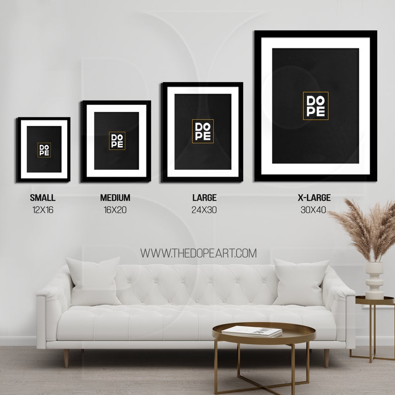 May include: Four black framed prints with white mats and a black background. The prints feature the word "DOPE" in gold lettering. The prints are labeled with their sizes: Small (12x16 inches), Medium (16x20 inches), Large (24x30 inches), and X-Large (30x40 inches). The prints are displayed on a white wall above a white sofa and a coffee table.