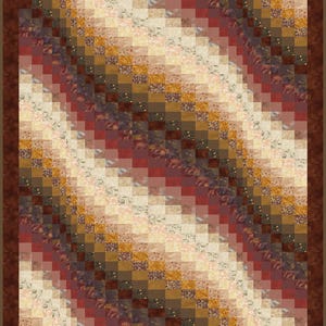May include: A patchwork quilt with a brown border. The quilt features a diagonal pattern of small squares in various shades of brown, beige, red, and gold. Some squares have floral patterns.