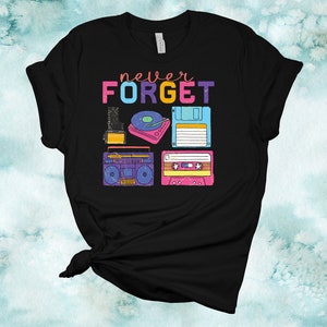 May include: Black t-shirt with the text "never FORGET" in rainbow colours. The shirt features a retro design with images of a cassette tape, a floppy disk, a record player, and a boombox.