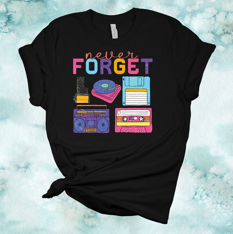 May include: Black t-shirt with the text "never FORGET" in rainbow colours. The shirt features a retro design with images of a cassette tape, a floppy disk, a record player, and a boombox.