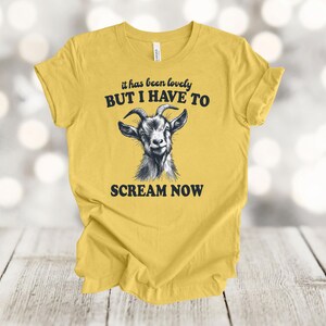 May include: A yellow t-shirt with a black and white goat illustration and the text "it has been lovely BUT I HAVE TO SCREAM NOW".