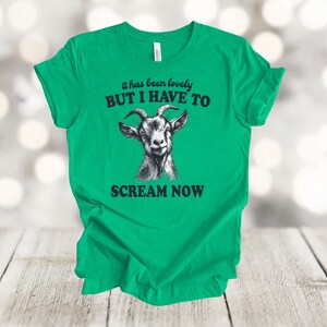 May include: Green t-shirt with a black and white goat illustration and the text "it has been lovely BUT I HAVE TO SCREAM NOW".